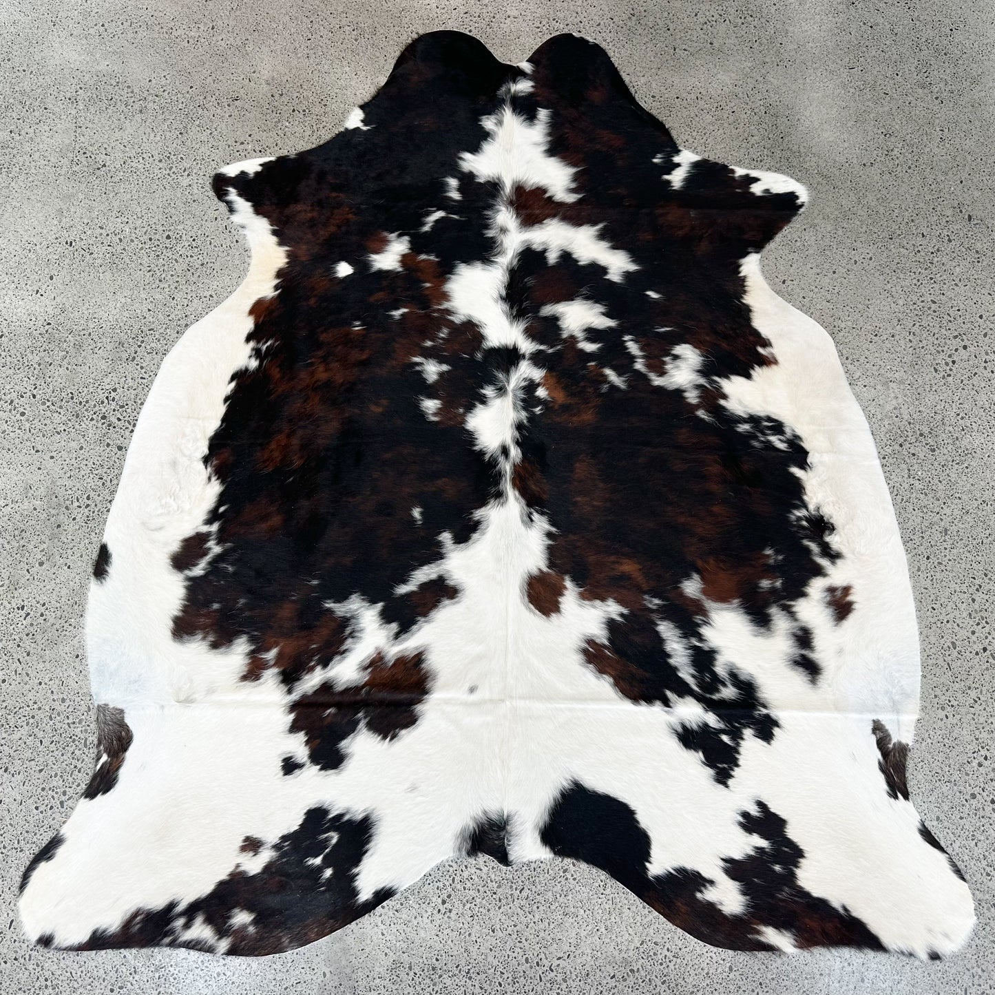 Large premium cowhide rug in black, brown and white