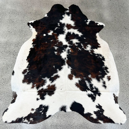 Large premium cowhide rug in black, brown and white