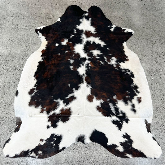 Large premium cowhide rug in black, brown and white
