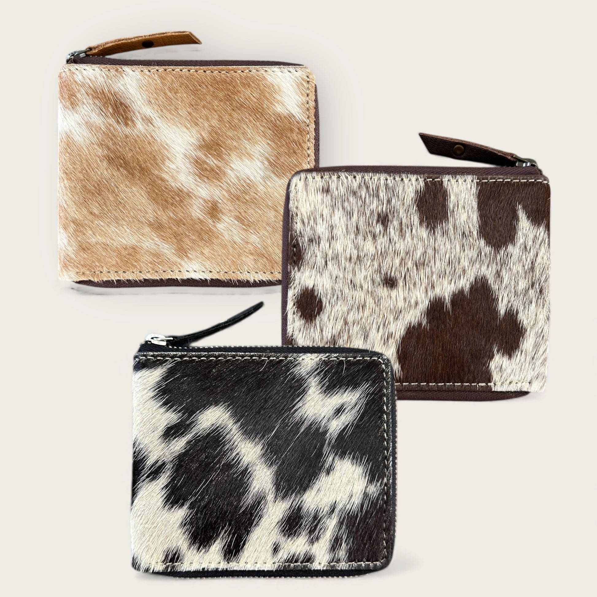 Unisex cowhide and leather wallet in tan, brown and black and white