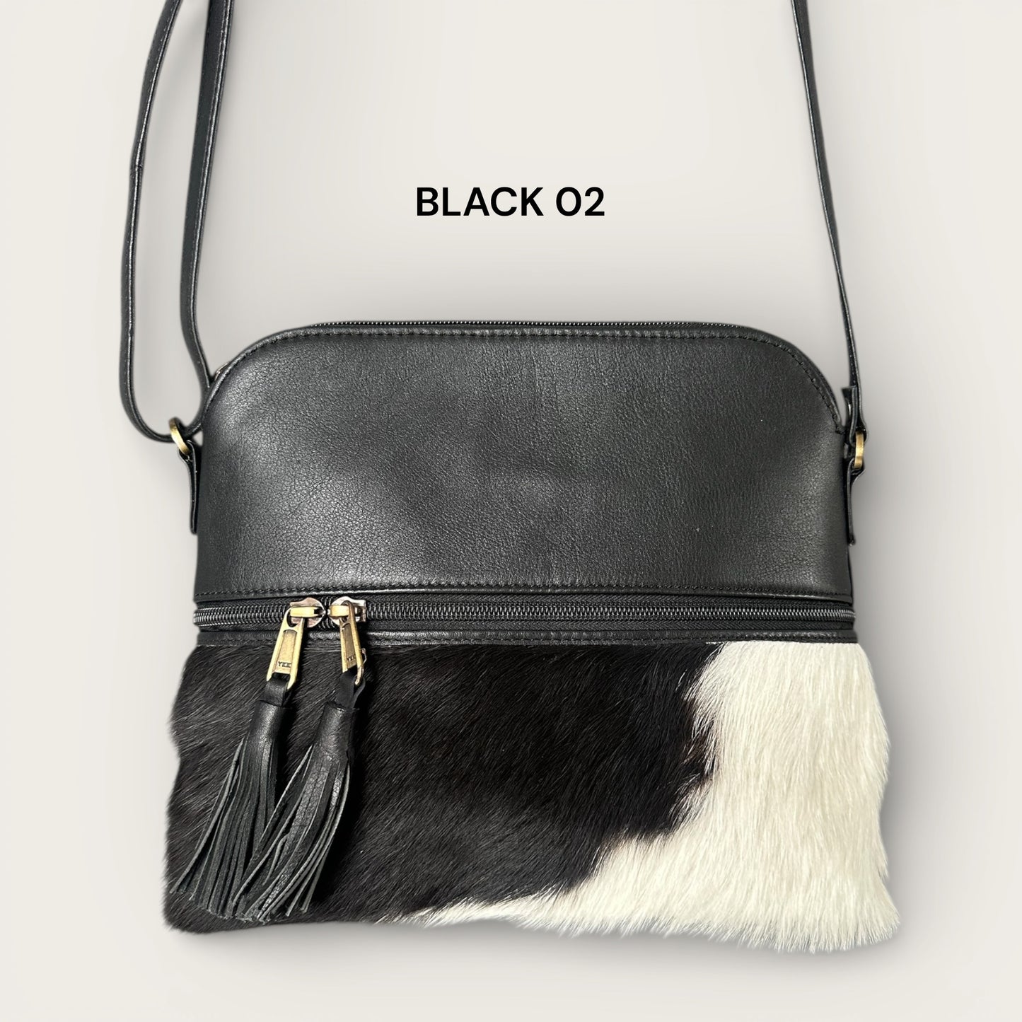 Large cowhide and leather crossbody bag in black & white 