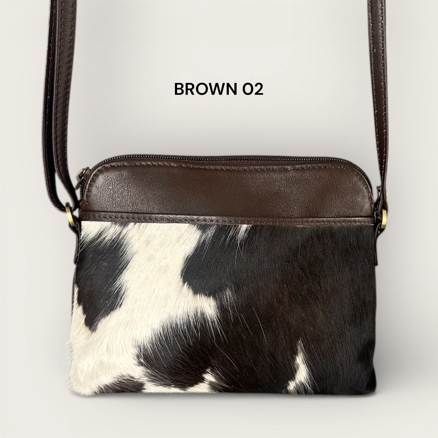 Cowhide and leather crossbody bag in brown & white
