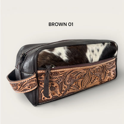 Cowhide and leather toiletry bag in brown and white with tooling details